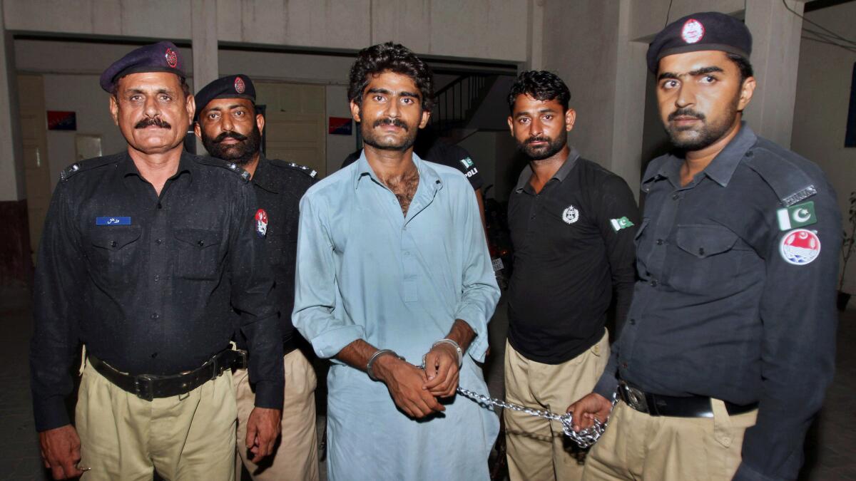 Pakistani police present Waseem Azeem, brother of slain model Qandeel Baloch, after his arrest in Multan.