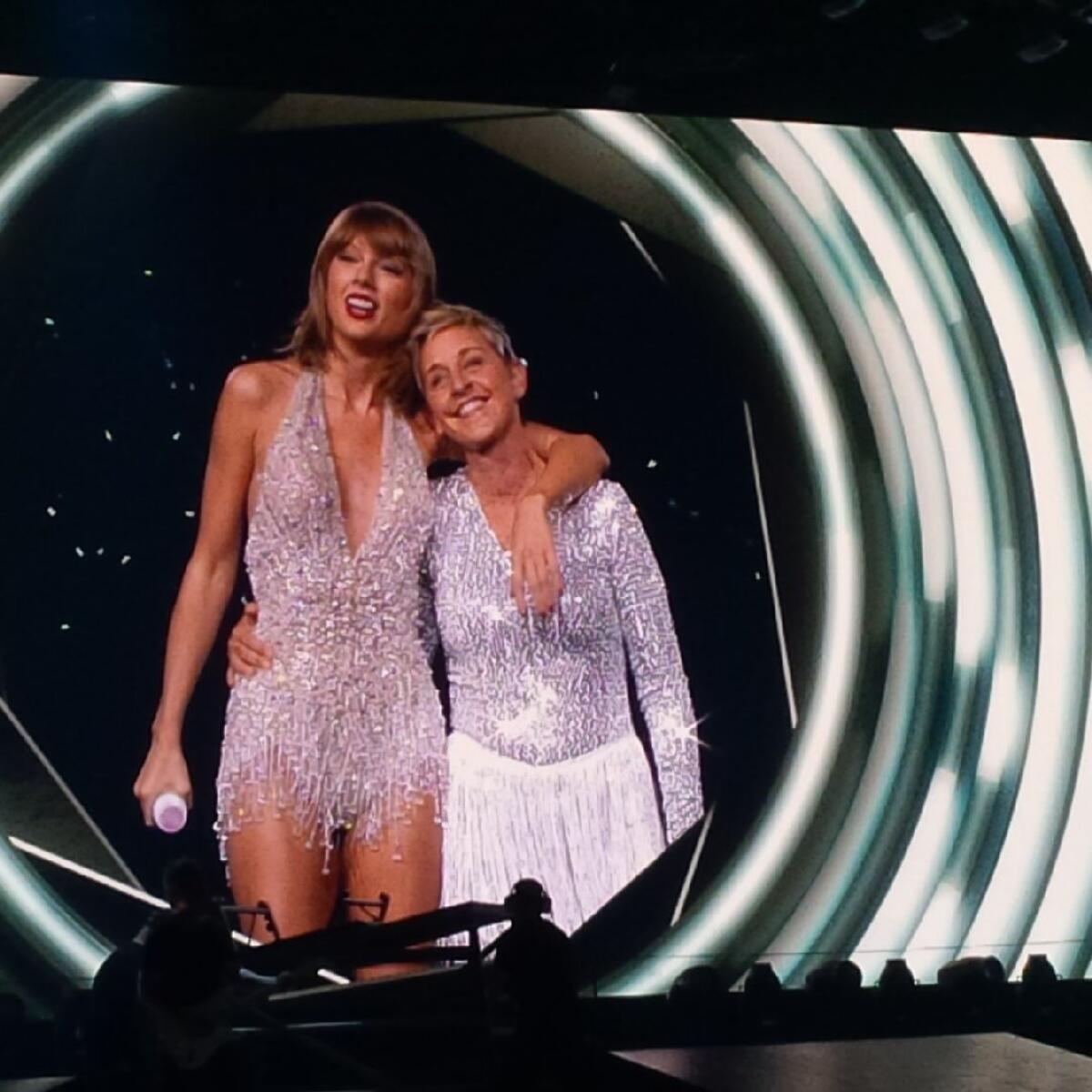 Taylor Swift, left, was joined by friend and talk-show host Ellen DeGeneres during her tour stop on Monday at Staples Center in Los Angeles.