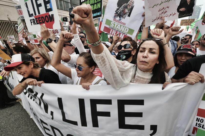 Protesters march in downtown Los Angeles on Sunday to denounce the Iranian government.