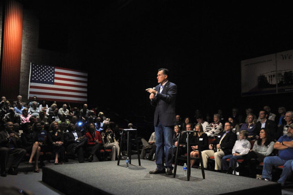 Mitt Romney speaks during a town hall meeting at Memminger Auditorium on Saturday in Charleston, S.C.