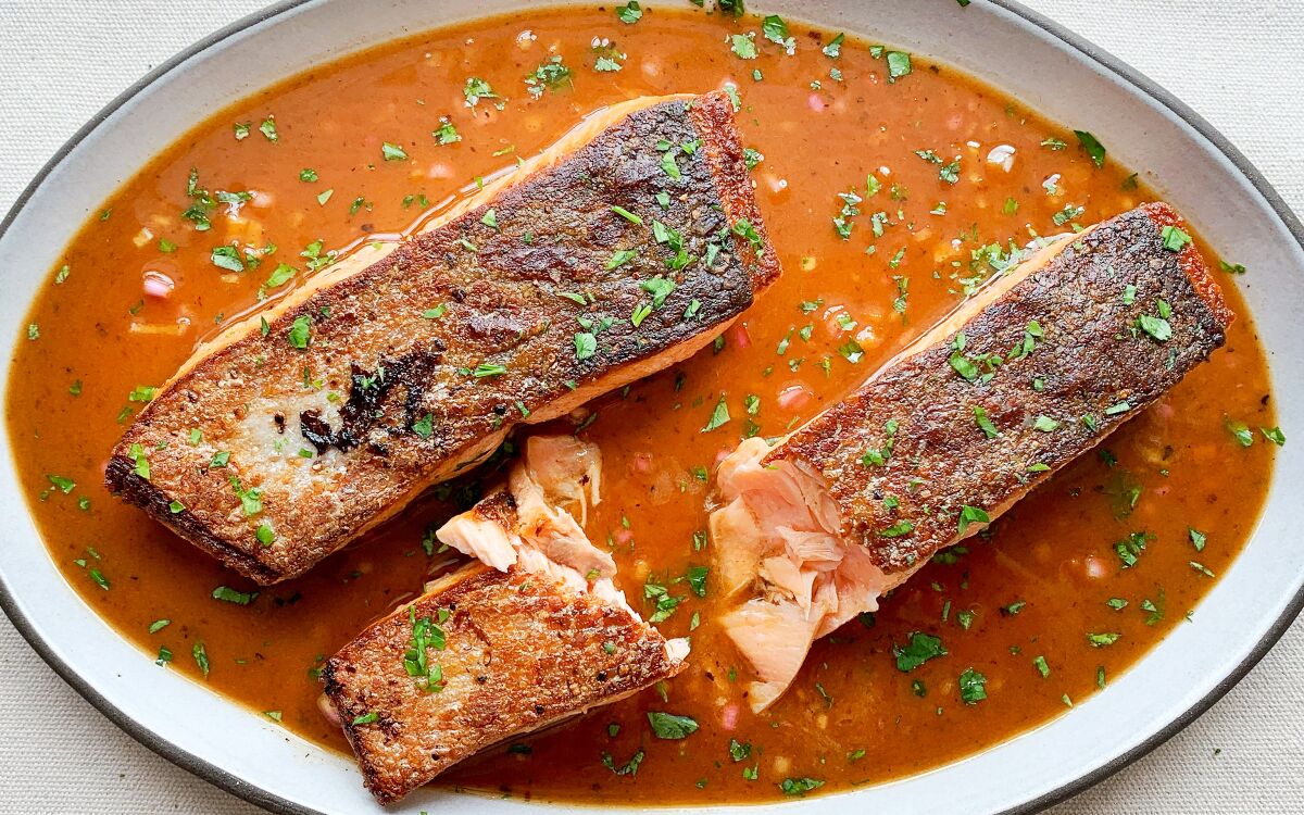 Salmon with crispy skin in a brown butter and chile vinaigrette