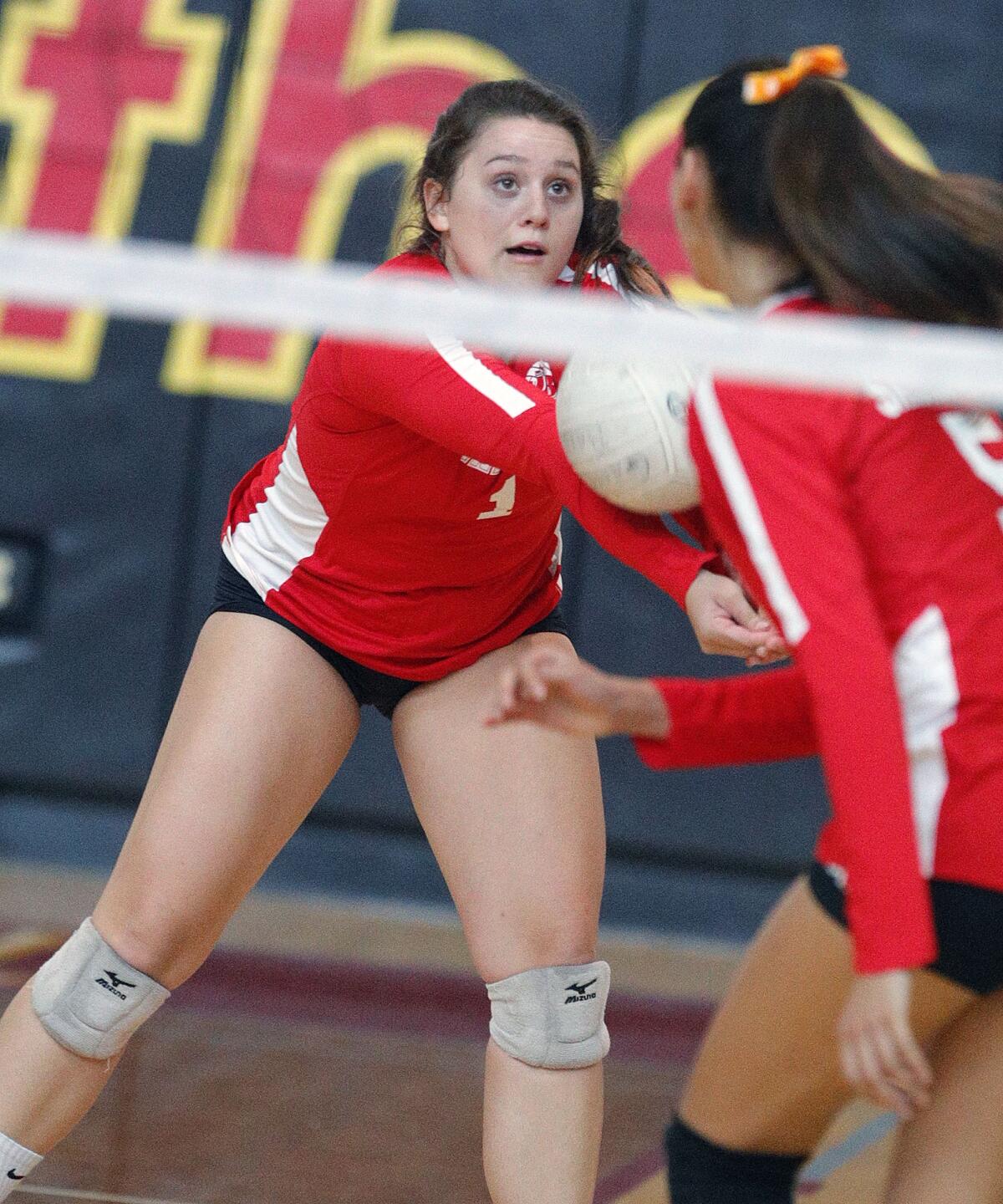 Burroughs' Lily Rogers digs an Arcadia serve into play in a Pacific League girls' volleyball match at Arcadia High School on Thursday, September 19, 2019. (Tim Berger / Staff Photographer)