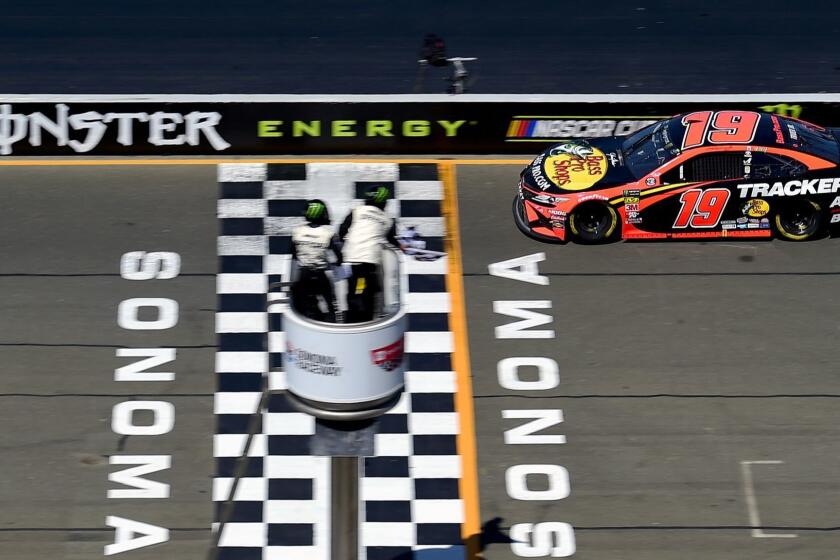 SONOMA, CALIFORNIA - JUNE 23: Martin Truex Jr., driver of the #19 Bass Pro Shops Toyota, crosses the finish line to win the Monster Energy NASCAR Cup Series Toyota/Save Mart 350 at Sonoma Raceway on June 23, 2019 in Sonoma, California. (Photo by Jared C. Tilton/Getty Images) ** OUTS - ELSENT, FPG, CM - OUTS * NM, PH, VA if sourced by CT, LA or MoD **