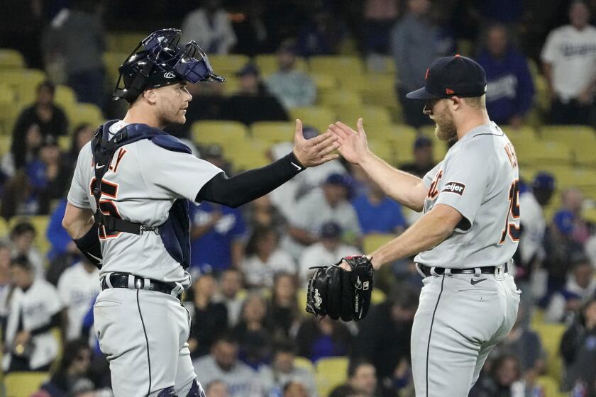 Detroit Tigers catcher Carson Kelly, left, and relief pitcher Will Vest congratulate each other after striking out Los Angeles Dodgers' James Outman to end the baseball game Wednesday, Sept. 20, 2023, in Los Angeles. The Tigers won 4-2. (AP Photo/Mark J. Terrill)