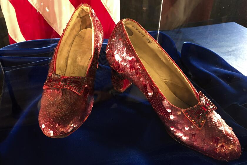 FILE - A pair of ruby slippers once worn by actress Judy Garland in the "The Wizard of Oz" sit on display at a news conference on Sept. 4, 2018, at the FBI office in Brooklyn Center, Minn. Federal prosecutors say a man has been indicted by a grand jury on Tuesday, May 16, 2023, on charges of stealing a pair of ruby red slippers worn by Judy Garland in “The Wizard of Oz.” The FBI recovered the slippers in 2018. (AP Photo/Jeff Baenen, File)