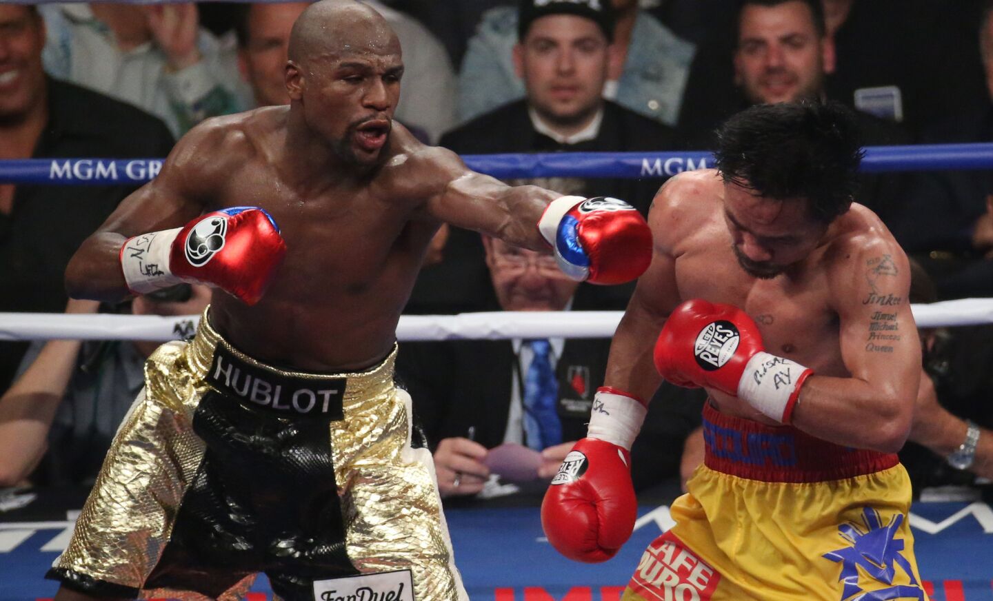 Floyd Mayweather Jr. connects with an 11th round punch on Manny Pacquiao.