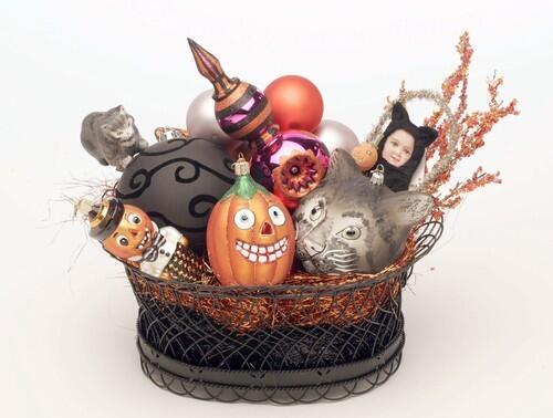 Halloween is the second-largest holiday decor season next to Christmas, so it's no surprise the two have merged sensibilities. A decorative selection from Rogers Gardens in Corona del Mar: black wire basket ($10); fuchsia ornament with polka dots ($45); cat baby with glass basket ($35); kitty clip ($40); Gray Cat Face ornament ($50); Pumpkin Boy ($10); 5-inch black ball ornament ($10); orange, black and lilac balls ($13 for set of 12); vintage jack-o-lantern ($8); black and orange shredded tinsel party grass ($13 each).