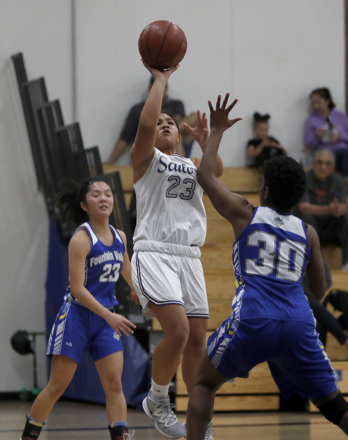 Newport Harbor's Cydney Jover (23) scores against Fountain Valley during a Wave League game on Saturday, Jan. 18, 2020.
