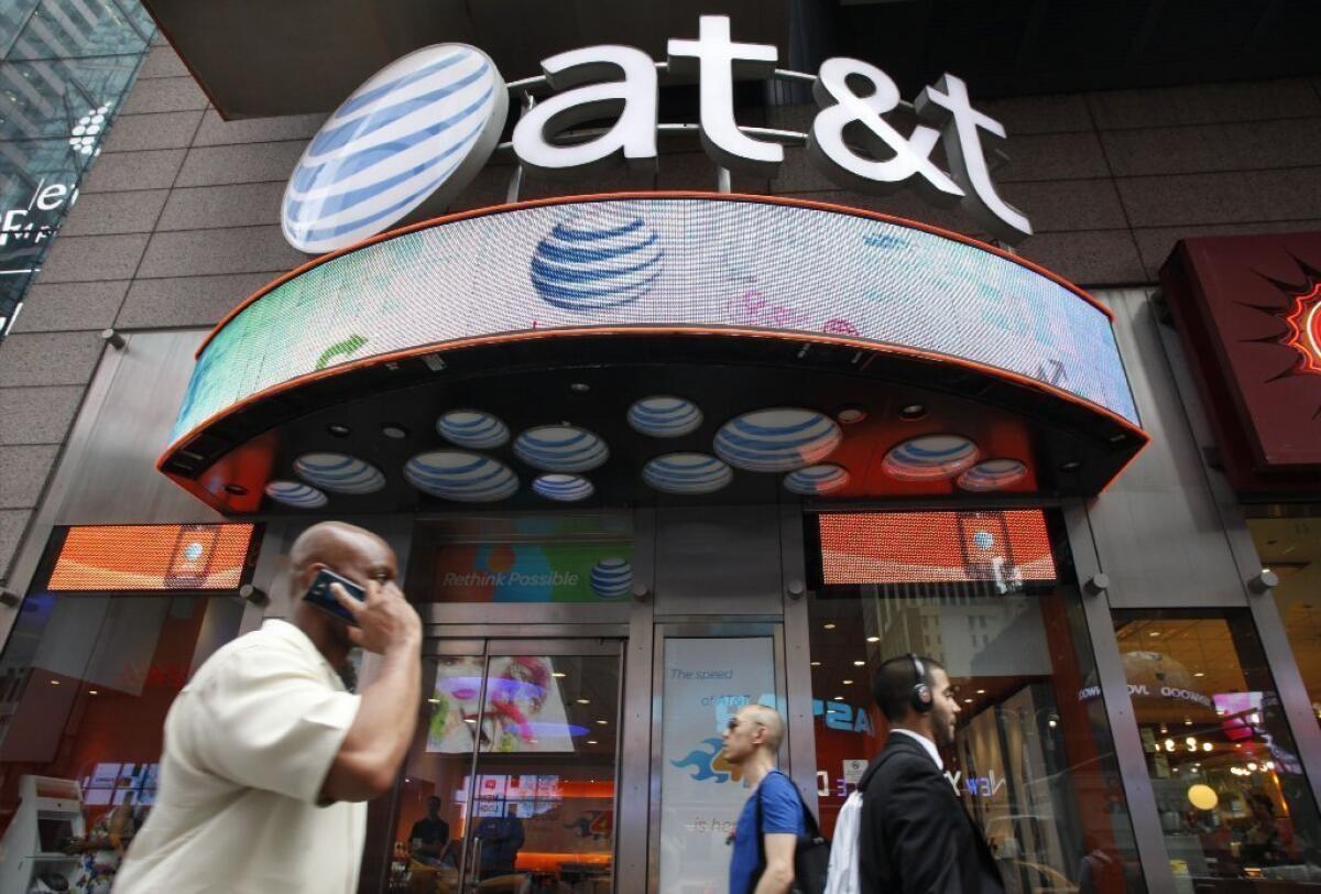 AT&T; has cut prices on its family plans. Above, an AT&T; store in New York.