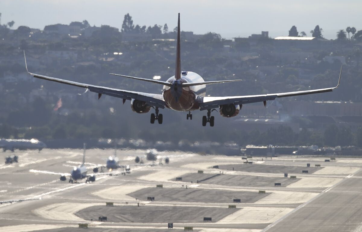 A Southwest Airlines passenger jet lands at San Diego International Airport on Friday, July 19, 2019.