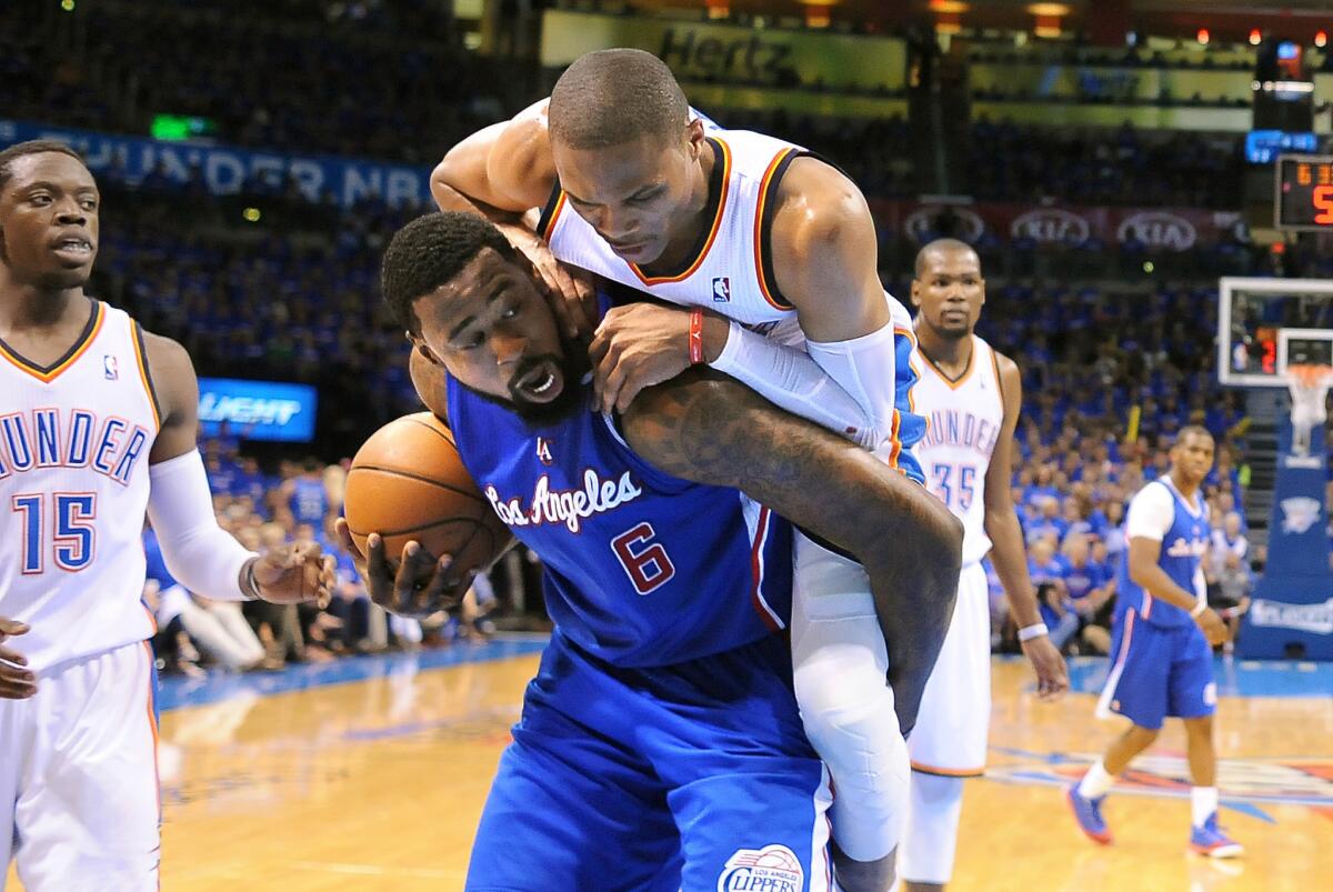 Clippers center DeAndre Jordan is fouled by Thunder point guard Russell Westbrook in the 2014 playoffs. Teams have been using the hack-a-Jordan strategy recently.