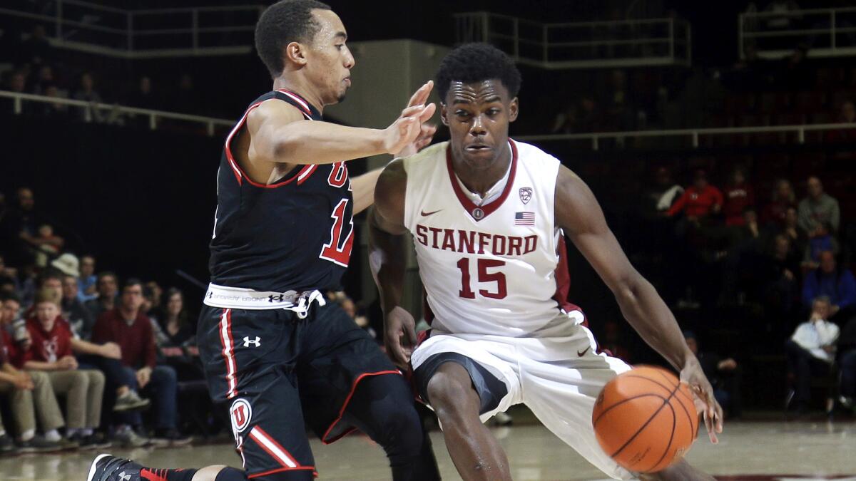 Stanford guard Marcus Allen (15) drives against Utah guard Brandon Taylor during the second half Friday night.