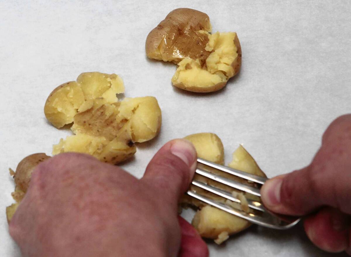 Giving the fries the perfect smash. Recipe