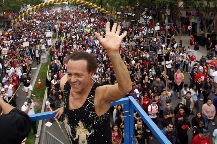 Fitness personality Richard Simmons warms up the crowd with an exercise routine before the 2013 AIDS Walk Los Angeles. Simmons recently addressed rumors that he was transitioning into a woman.