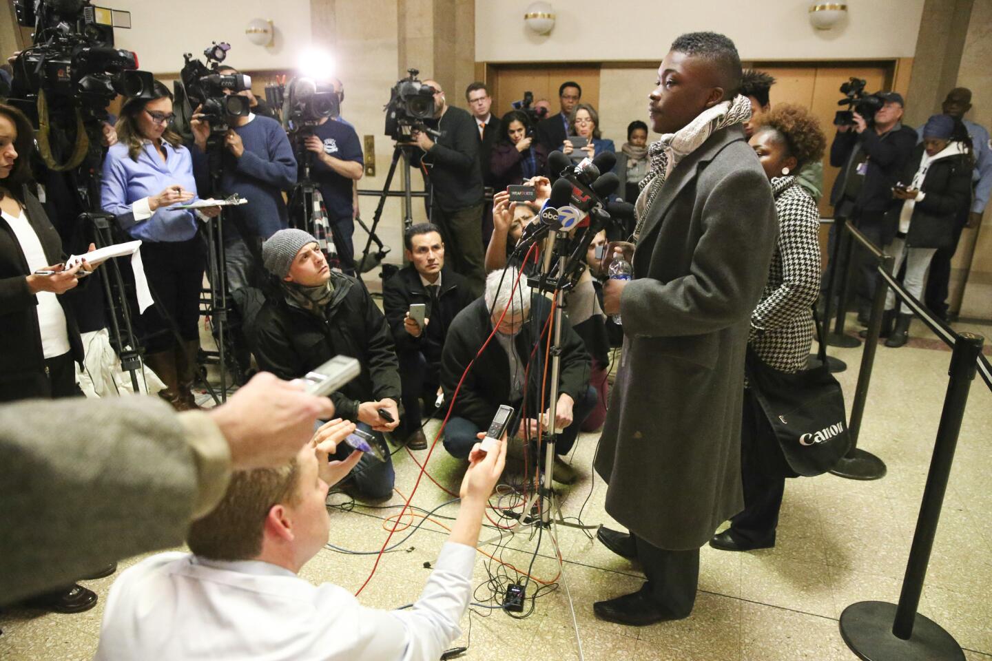 Activist Ja' Mal Green of Skyrocketing Teens Corp. speaks with reporters after a meeting with Mayor Rahm Emanuel at City Hall in Chicago on Nov. 23, 2015.