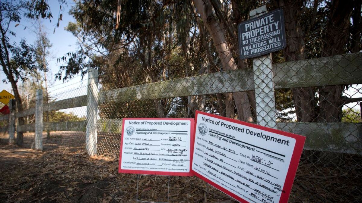 Notices of proposed development are posted along the coast near Gaviota, Calif.