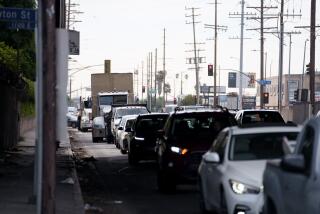 LOS ANGELES CA NOVEMBER 13, 2023 - Traffic under Interstate 10 near the site of a fire in Los Angeles, California. (Eric Thayer / For The Times)