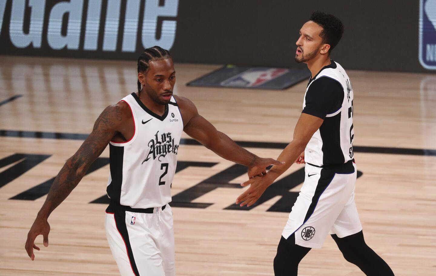 Clippers guard Landry Shamet reacts with forward Kawhi Leonard after a foul.