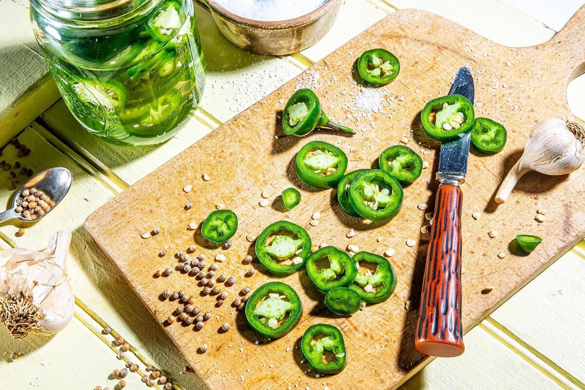 Slice jalapeños into rounds. You could pluck out the seeds, but leave them in for extra heat.