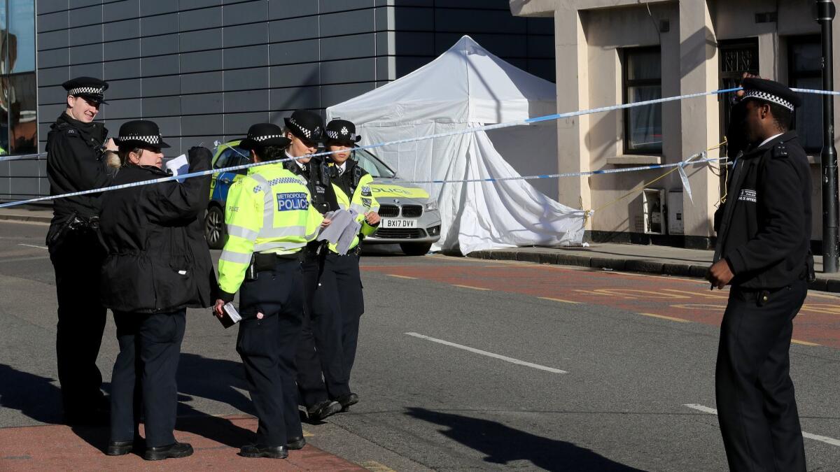 A forensic tent covers the scene where a 20-year-old man collapsed after being fatally stabbed on April 5, 2018, in London. The man approached police officers and was given first aid at the scene but later died.