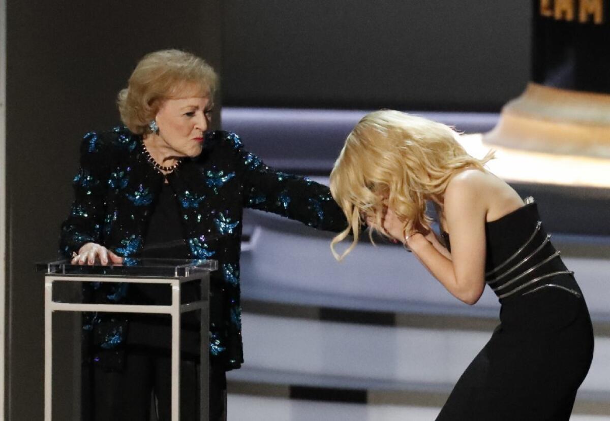 Kate McKinnon, right, shows her appreciation to Betty White at Monday's Emmy Awards.