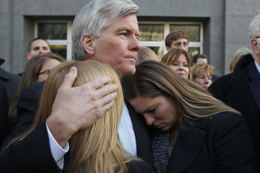 Former Virginia Gov. Bob McDonnell hugs his daughters after he was sentenced outside federal court in Richmond, Va. on Jan. 6, 2015.