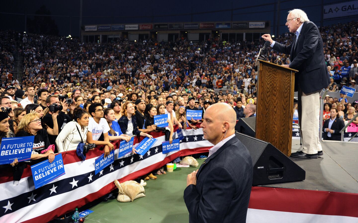 Security looks on as Bernie Sanders addresses supporters at StubHub Center in Carson.