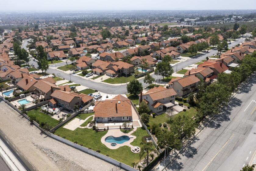 Rancho Cucamonga, CA, Wednesday, April 27, 2022 - A drone image over a housing tract that is part of the state water project, where outdoor watering to one day a week. Water Shortage Emergency to be declared in communities in Los Angeles, San Bernardino and Ventura counties, home to 6 million Southern Californians. These homes are located near the intersection of Wilson and Milliken Avenues. (Robert Gauthier/Los Angeles Times)
