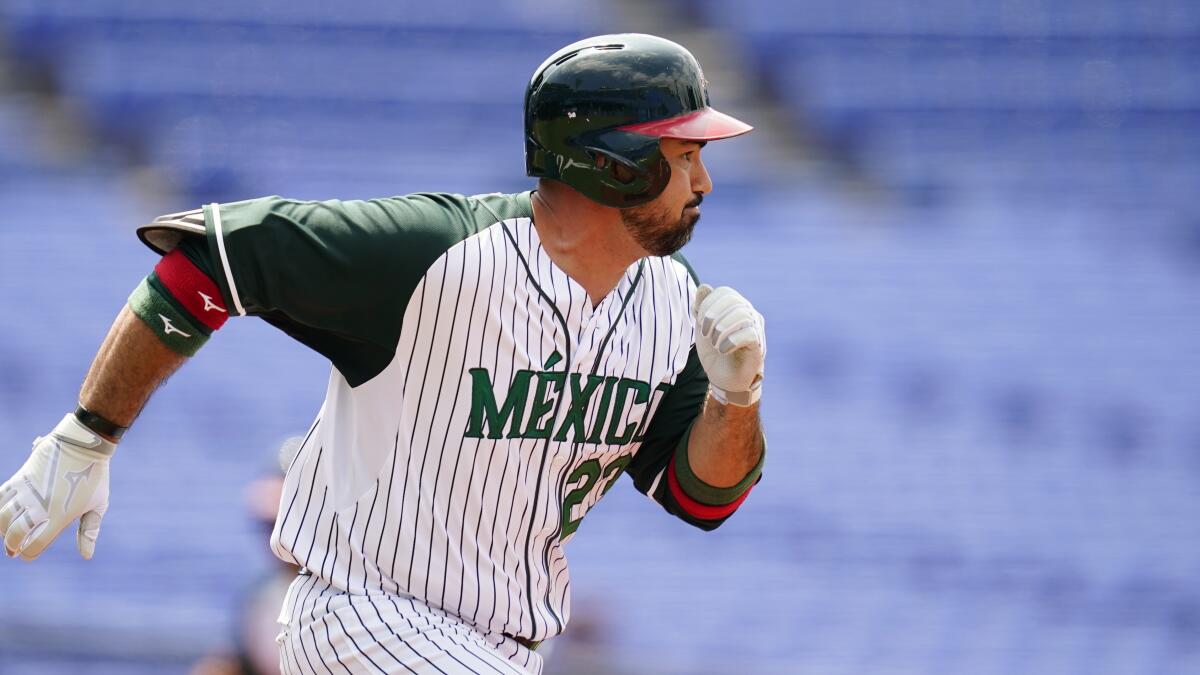 Mexico's Adrian Gonzalez runs to first during a game against Japan on Saturday.