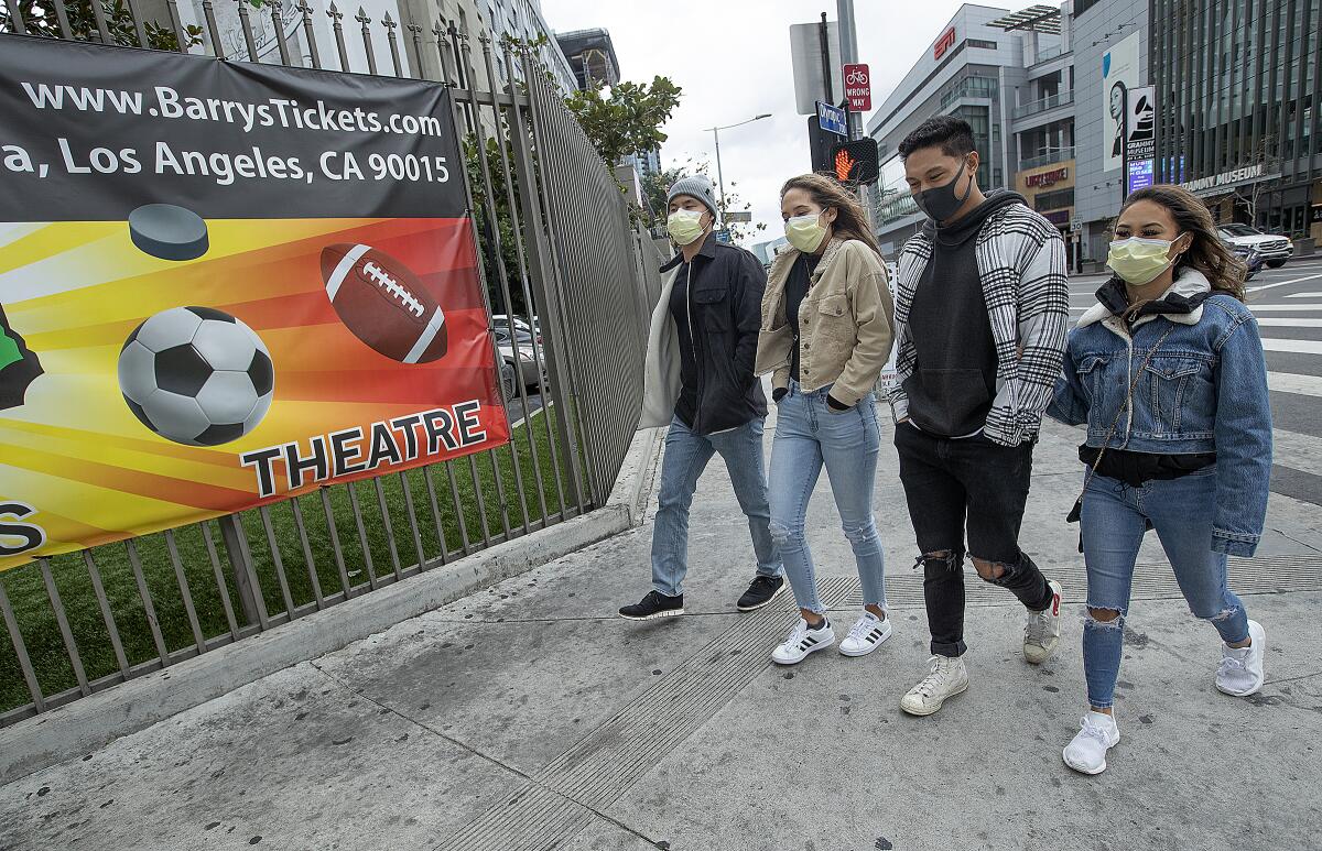 People wearing masks on an L.A. street