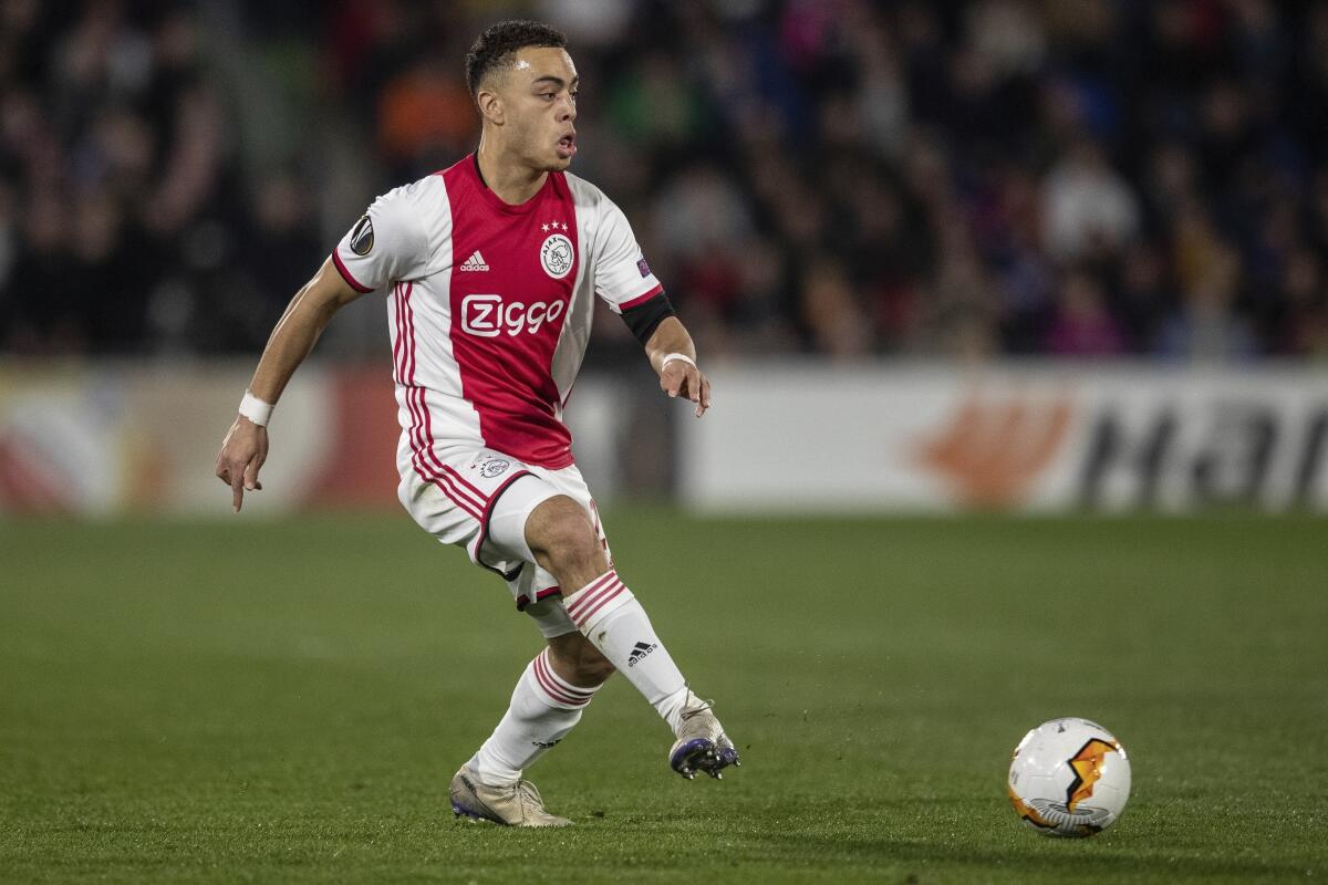  Sergiño Dest kicks the ball during an Europa League soccer match.