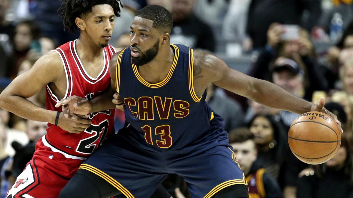 Cavaliers forward Tristan Thompson (13) works against Bulls guard Cameron Payne during a game in February.