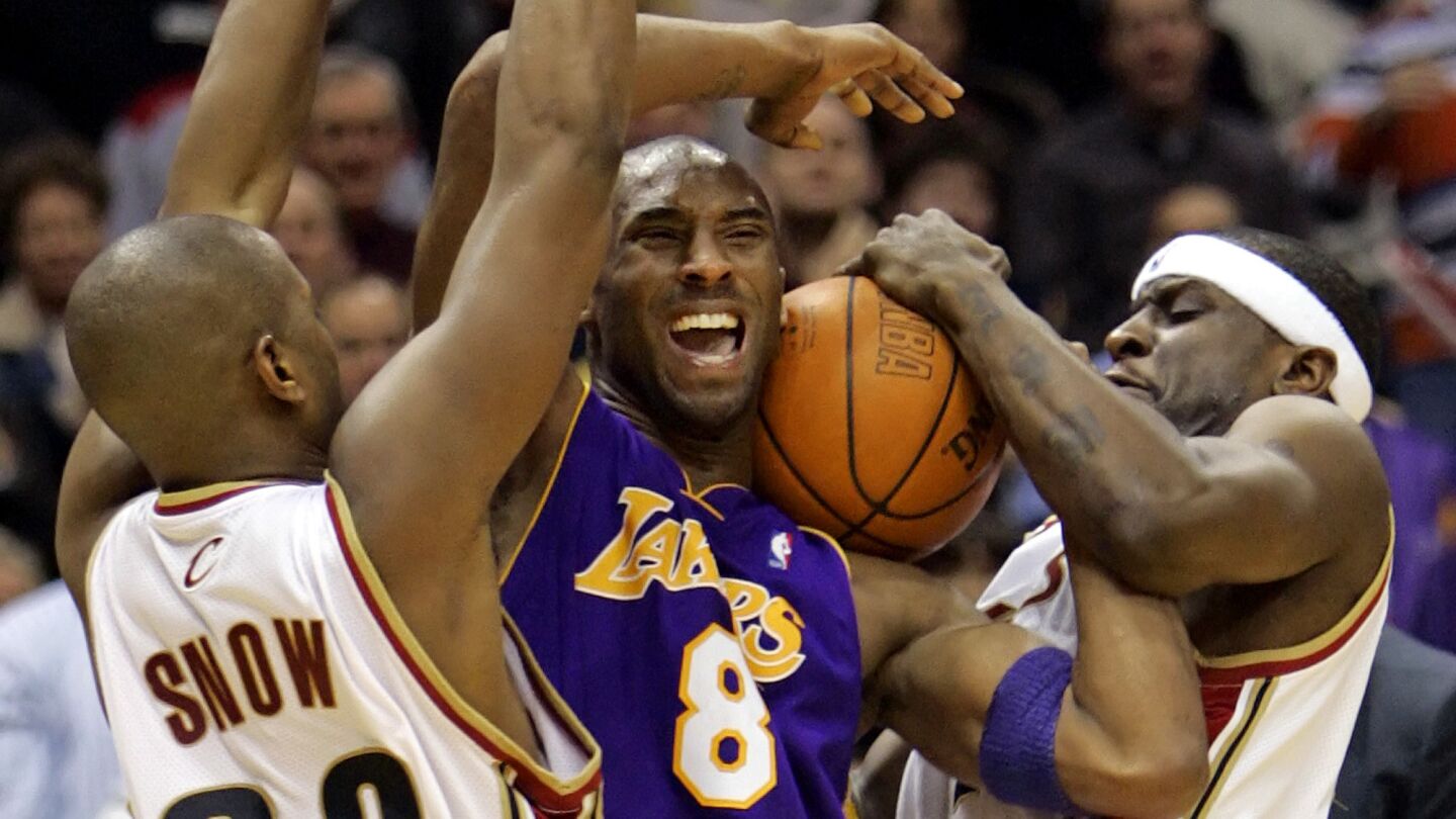 Lakers star Kobe Bryant, center, is double-teamed by Cleveland Cavaliers teammates Eric Snow, left, and Flip Murray during a game on March 19, 2006.