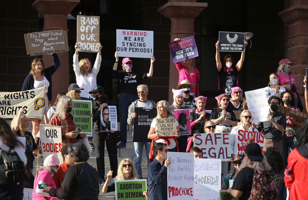 About a hundred local abortion rights advocates gather for "Bans Off Our Bodies"
