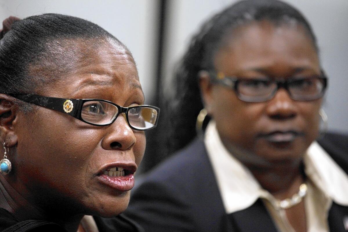 Marlene Pinnock, left, and her attorney, Caree Harper, speak to reporters on Aug. 20.