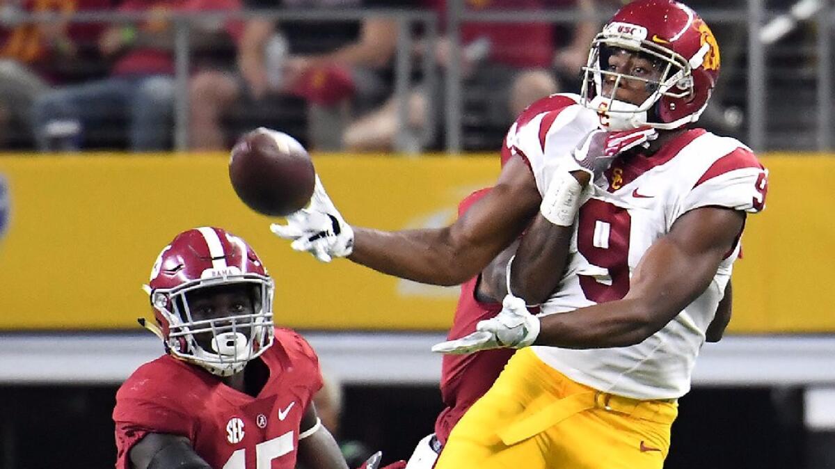 USC receiver JuJu Smith-Schuster tries to make a catch against Alabama during a Sept. 3 game in Arlington, Texas.