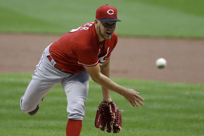 Cincinnati Reds' Trevor Bauer pitches during the first inning of a baseball game against the Milwaukee Brewers.
