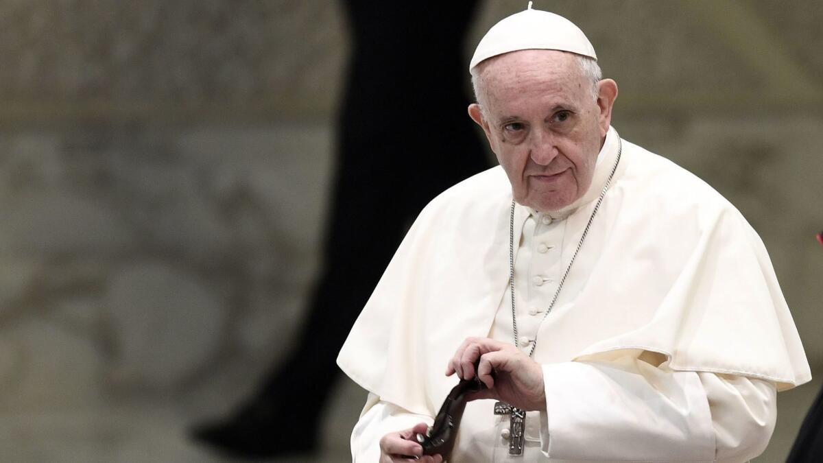 Pope Francis attends his weekly general audience at the Vatican on Aug. 8.