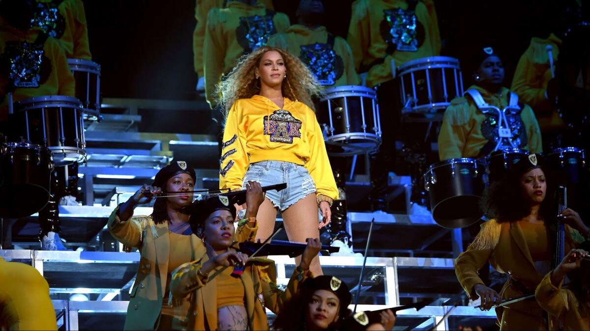 Beyoncé performs onstage Saturday night during the first weekend of the 2018 Coachella Valley Music and Arts Festival in Indio, Calif.