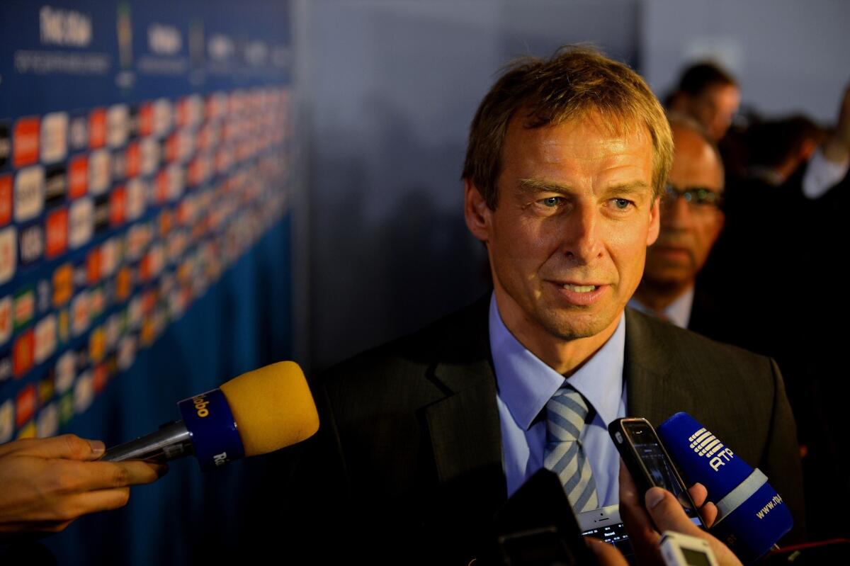 United States men's soccer Coach Juergen Klinsmann speaks to reporters after the final draw for the 2014 FIFA World Cup. Klinsmann says the U.S. will be playing in the one of the tournament's most difficult groups.