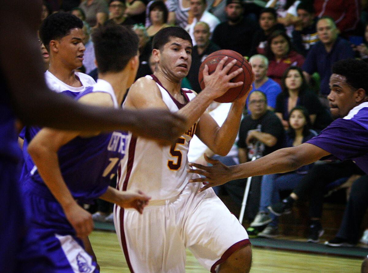 Cantwell-Sacred Heart's Joey Covarrubias makes his way to the basket during a game against Cathedral on Jan. 17.