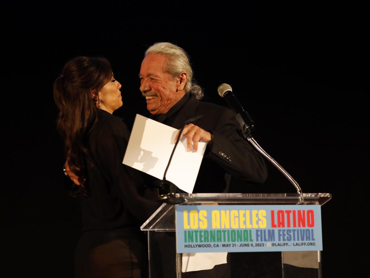 Edward James Olmos hugs Eva Longoria at the Los Angeles Latino International Film Festival last May.