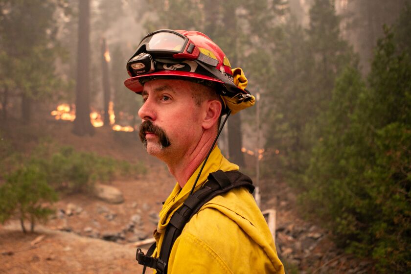 eSTRAWBERRY, CA - AUGUST 27: Jason Hunter, a spokesperson for the Caldor fire gives and update on the path of the fire as its footprint continues to expand southwest of the Lake Tahoe Basin on Friday, Aug. 27, 2021 in Strawberry, CA. (Jason Armond / Los Angeles Times)