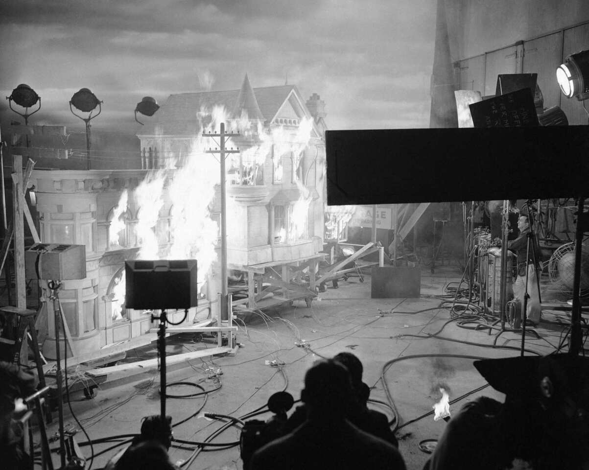 A scale model of a Los Angeles street goes up in flames on a Hollywood sound stage during filming of the scene from "War of the Worlds" on June 6, 1952.