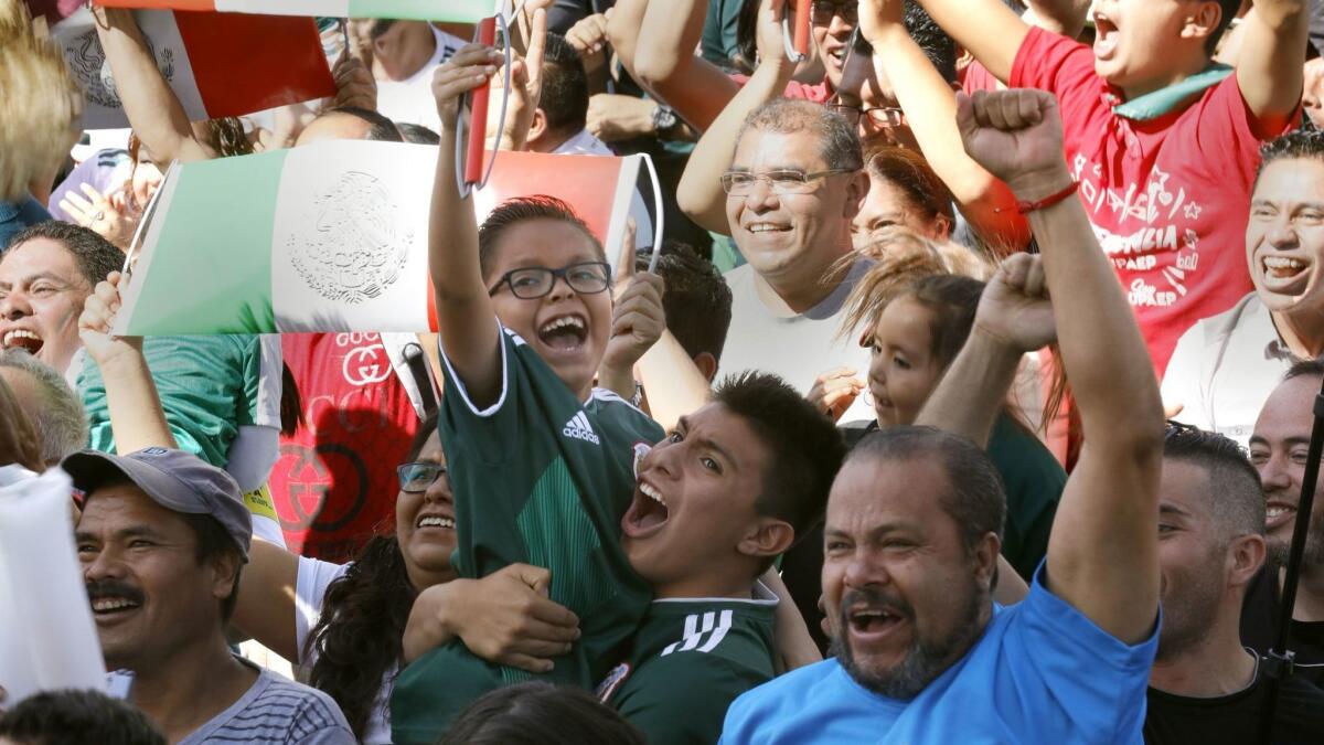 Soccer fans in Mexico City celebrate their team winning the FIFA World Cup 2018 group F preliminary round match against Germany on June 17, 2018.