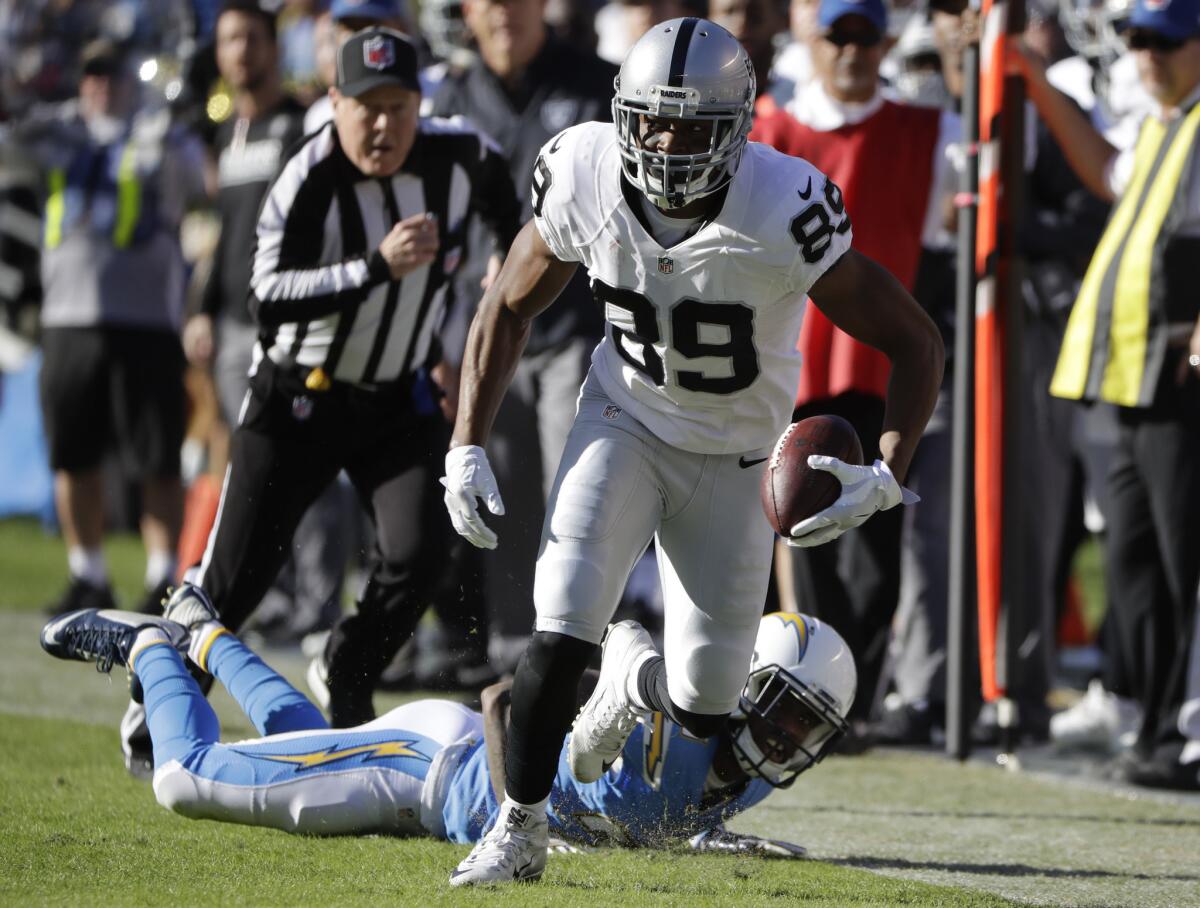 Raiders wide receiver Amari Cooper runs with the ball during the first half on Dec. 18.