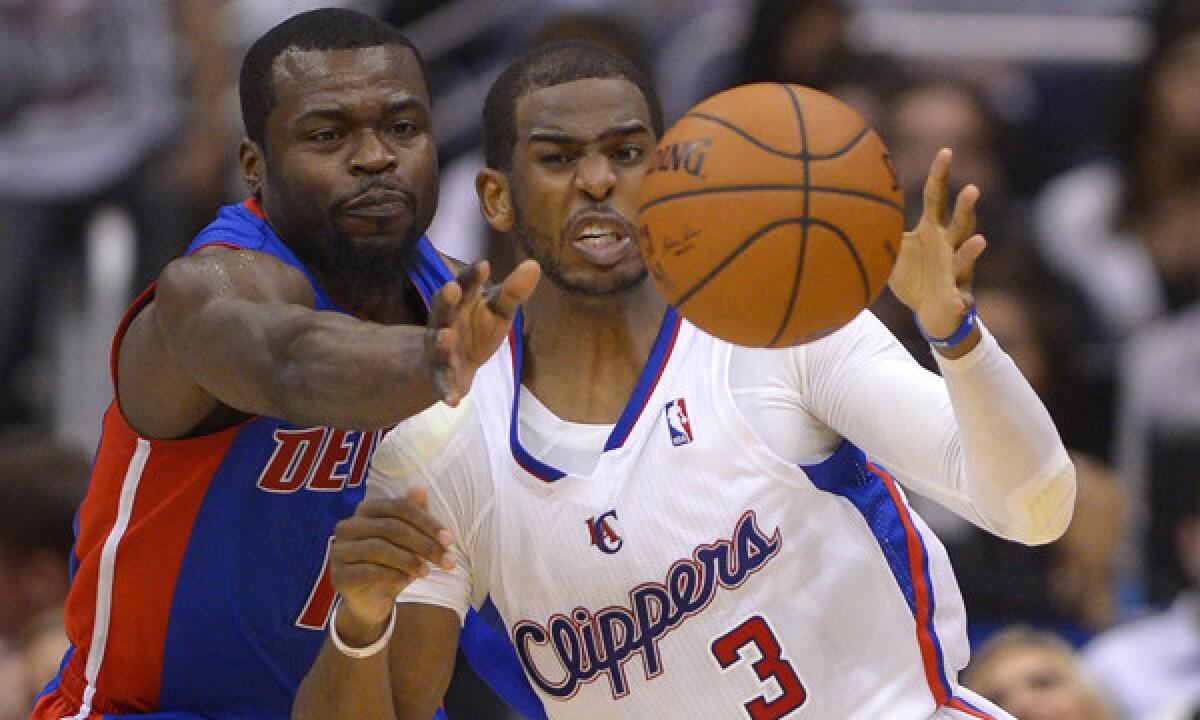 Clippers point guard Chris Paul, right, tries to drive around Detroit Pistons guard Will Bynum during the Clippers' win Saturday at Staples Center. Paul recorded his 6,000th career assist in the victory.