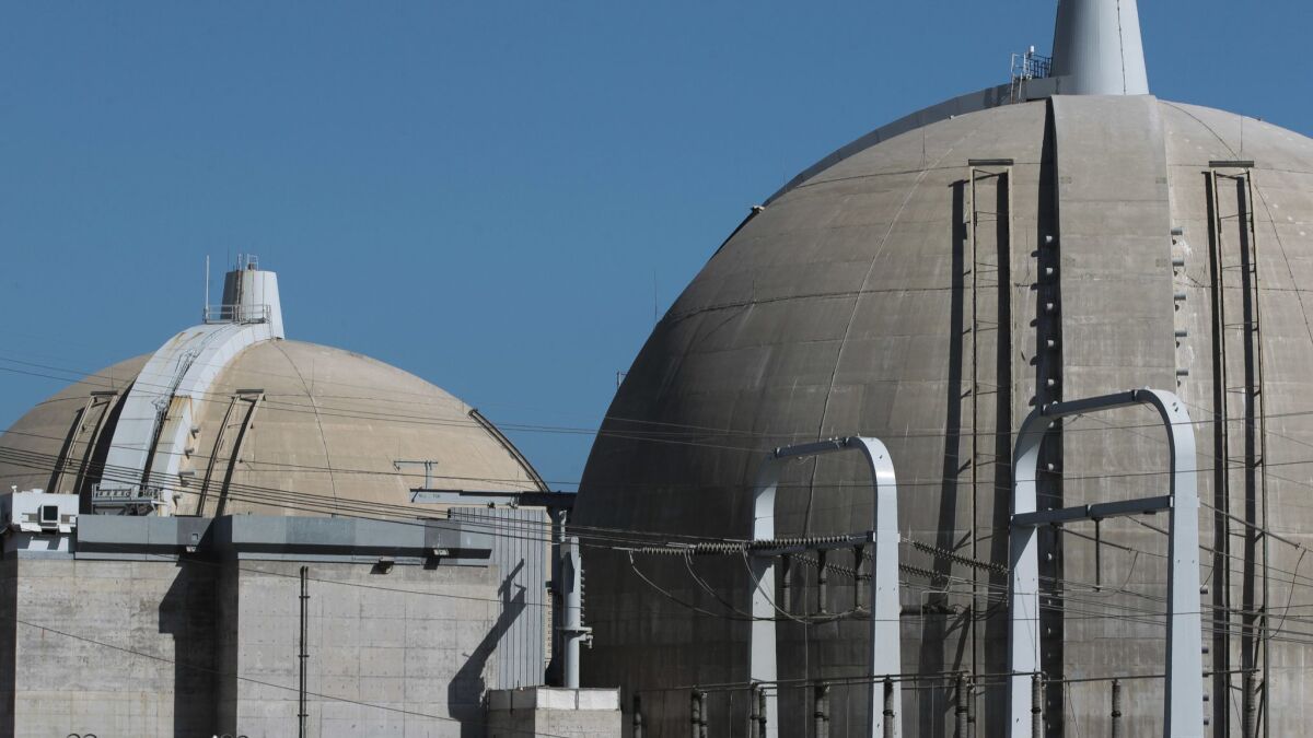 A 2016 file photo of the Unit 2, right, and Unit 3 reactor containment structures at the San Onofre Nuclear Generating Station. Small amounts of asbestos have been found in both structures.
