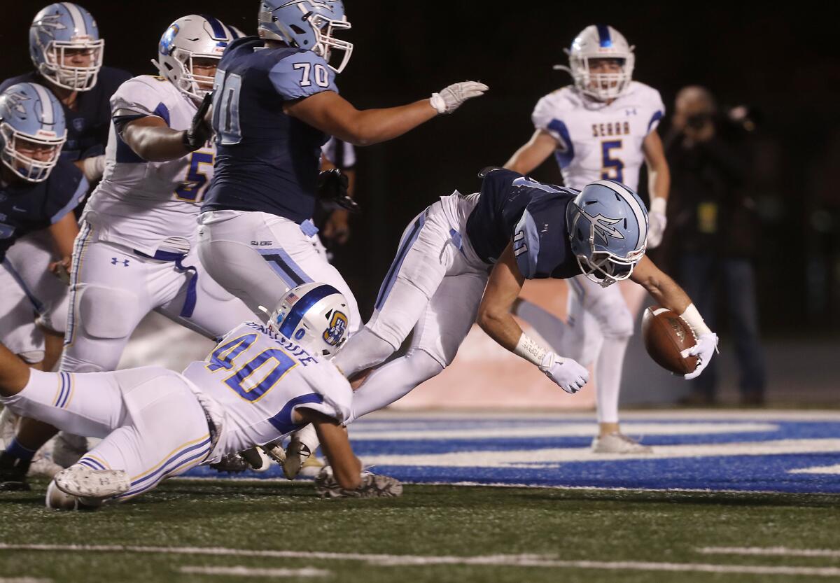 Corona del Mar's Bradley Schlom scores on a one-yard touchdown catch against Serra in the CIF State Division 1-A title game at Cerritos College on Dec. 14, 2019.
