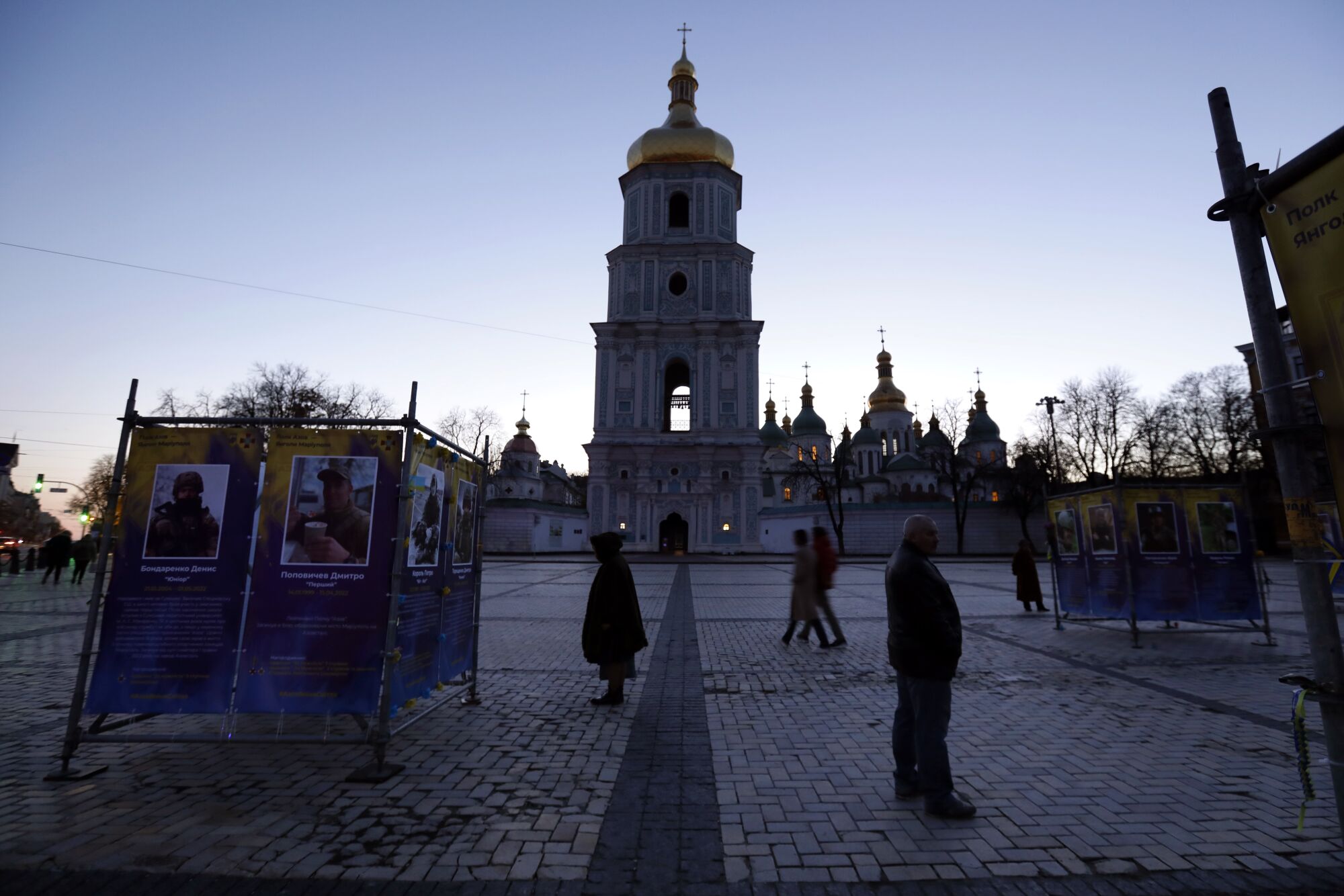 People in silhouette in Kyiv's Saint Sophia Cathedral square